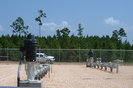 PW-1, Foreground, and PW-2 of This New 4.32 MGD Industrial Wellfield.  Woods Seen in the Background Are What the Property Looked Like at the Project's Inception